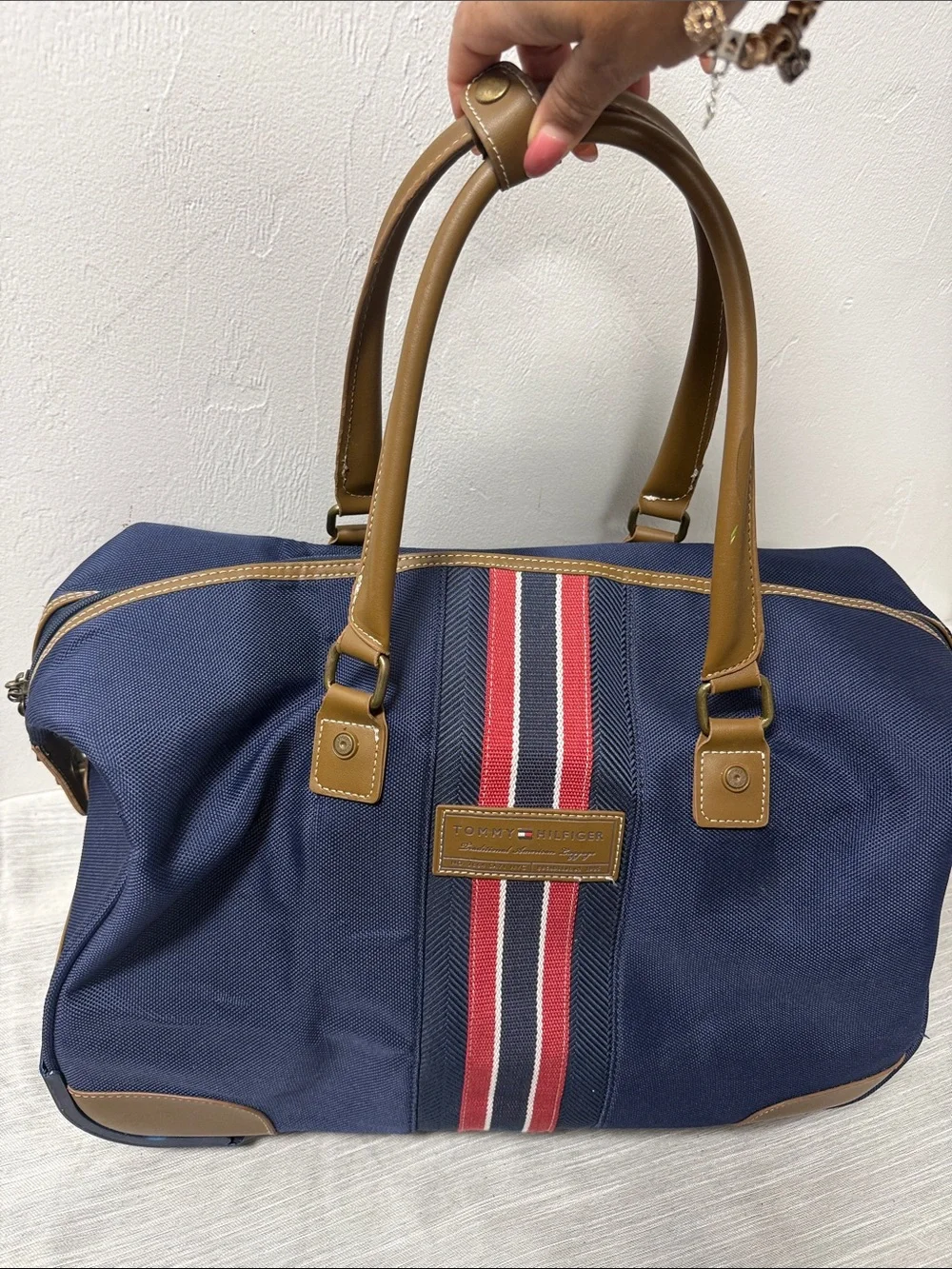Tommy Hilfiger Navy rolling Duffel with Red & White Center Stripe  carry on